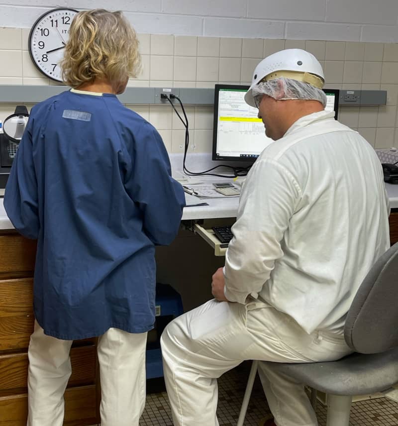 Two Preston Protein team members working together